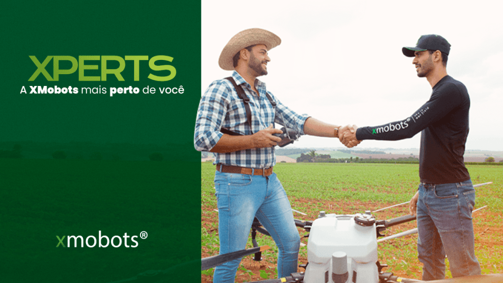 XPert and farmer shaking hands with a DJI AGRAS T40 drone between them.